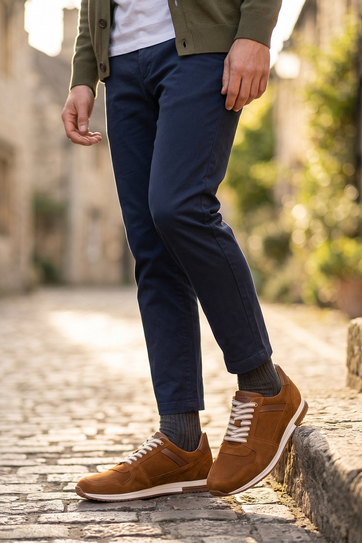 Model wearing Rory sand suede leather sneakers for men, showcasing premium craftsmanship and durable construction for stylish everyday wear