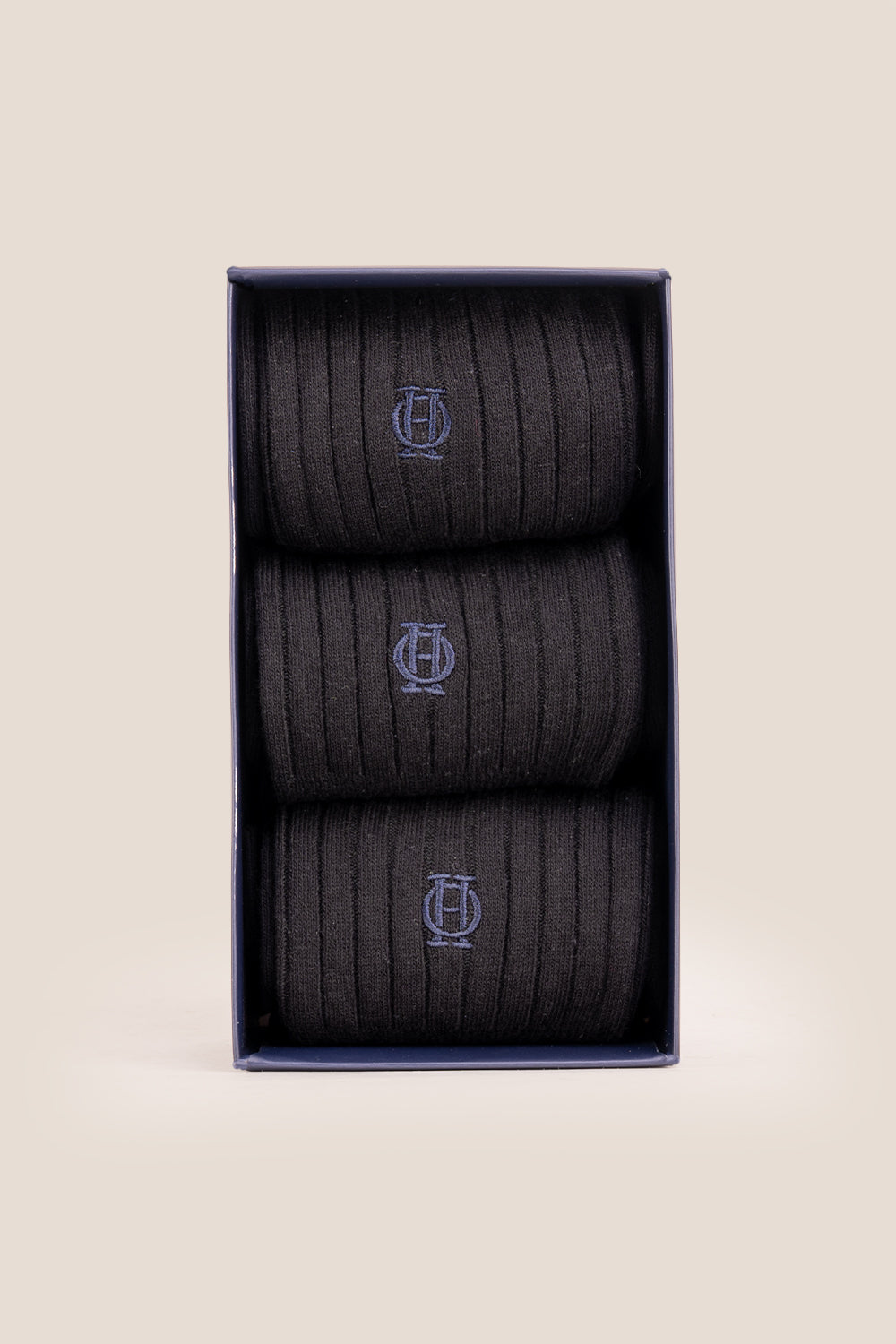 Three pairs of premium black cotton socks designed by Oswin Hyde for the discerning gentleman.
