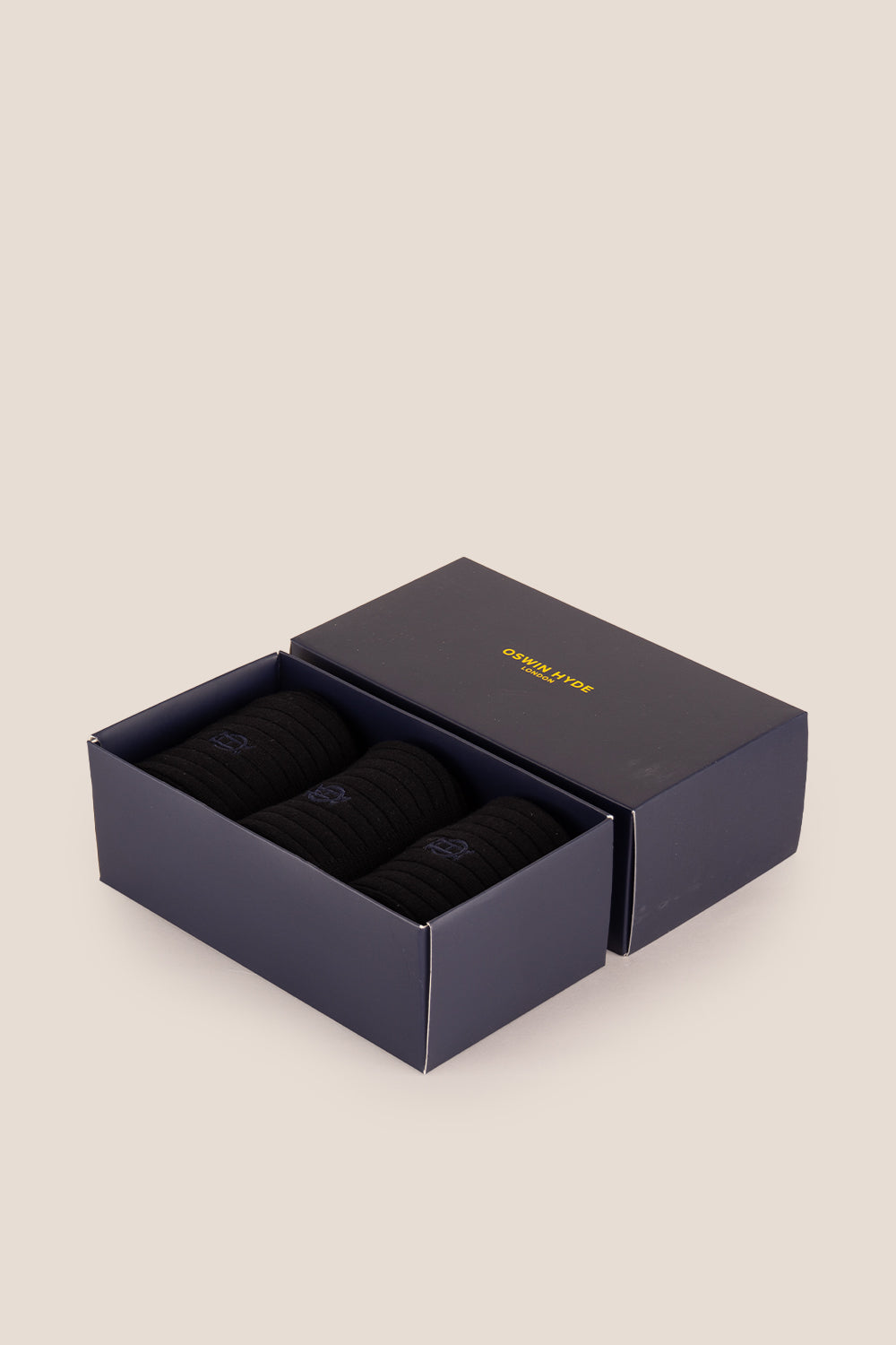 Three pairs of premium black cotton socks designed by Oswin Hyde for the discerning gentleman.
