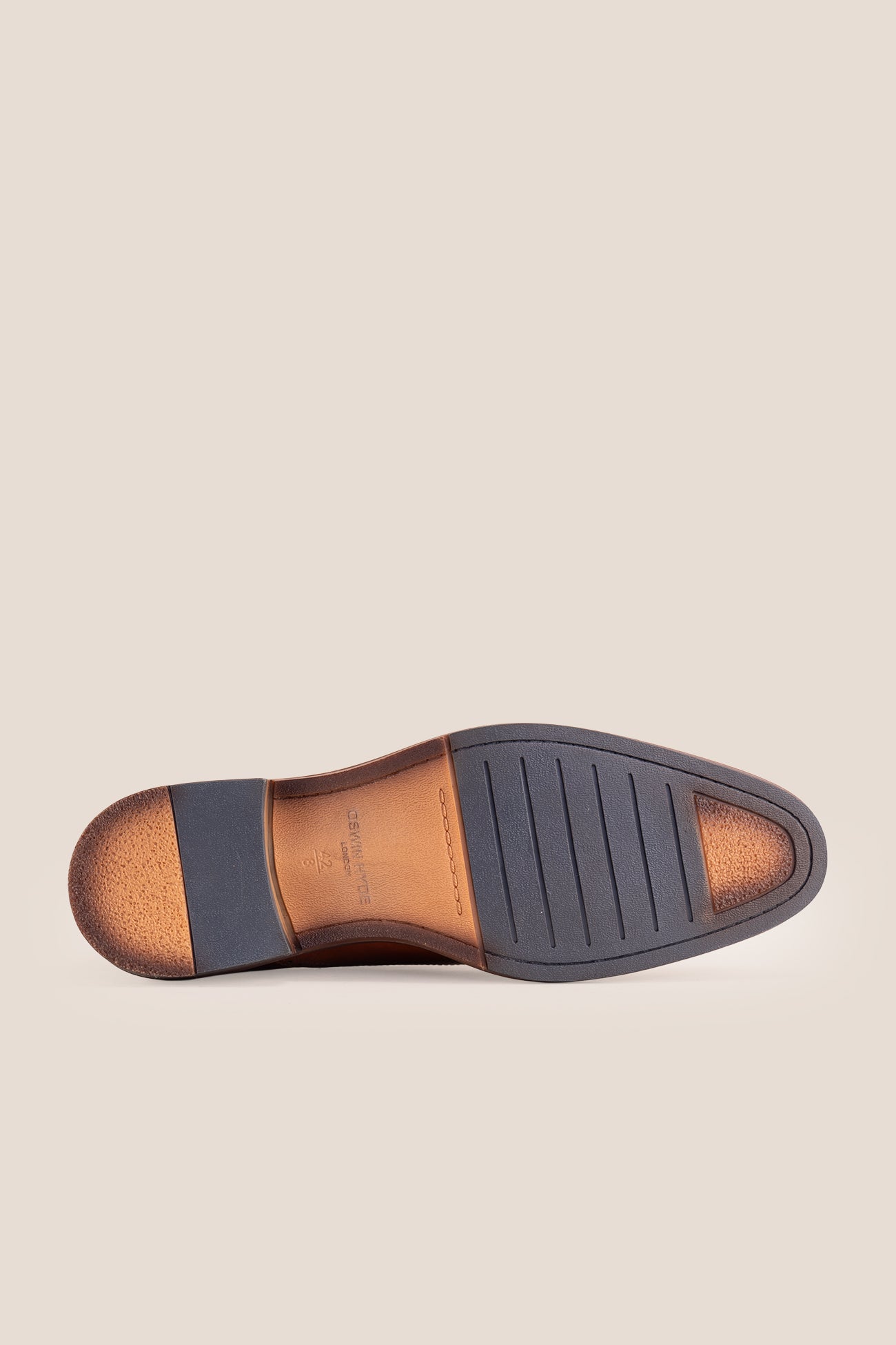 Premium men's tan leather oxford shoes by Oswin Hyde London, featuring a cap toe with decorative perforations, closed lacing, contrast welt stitching, and a cushioned teal interior.