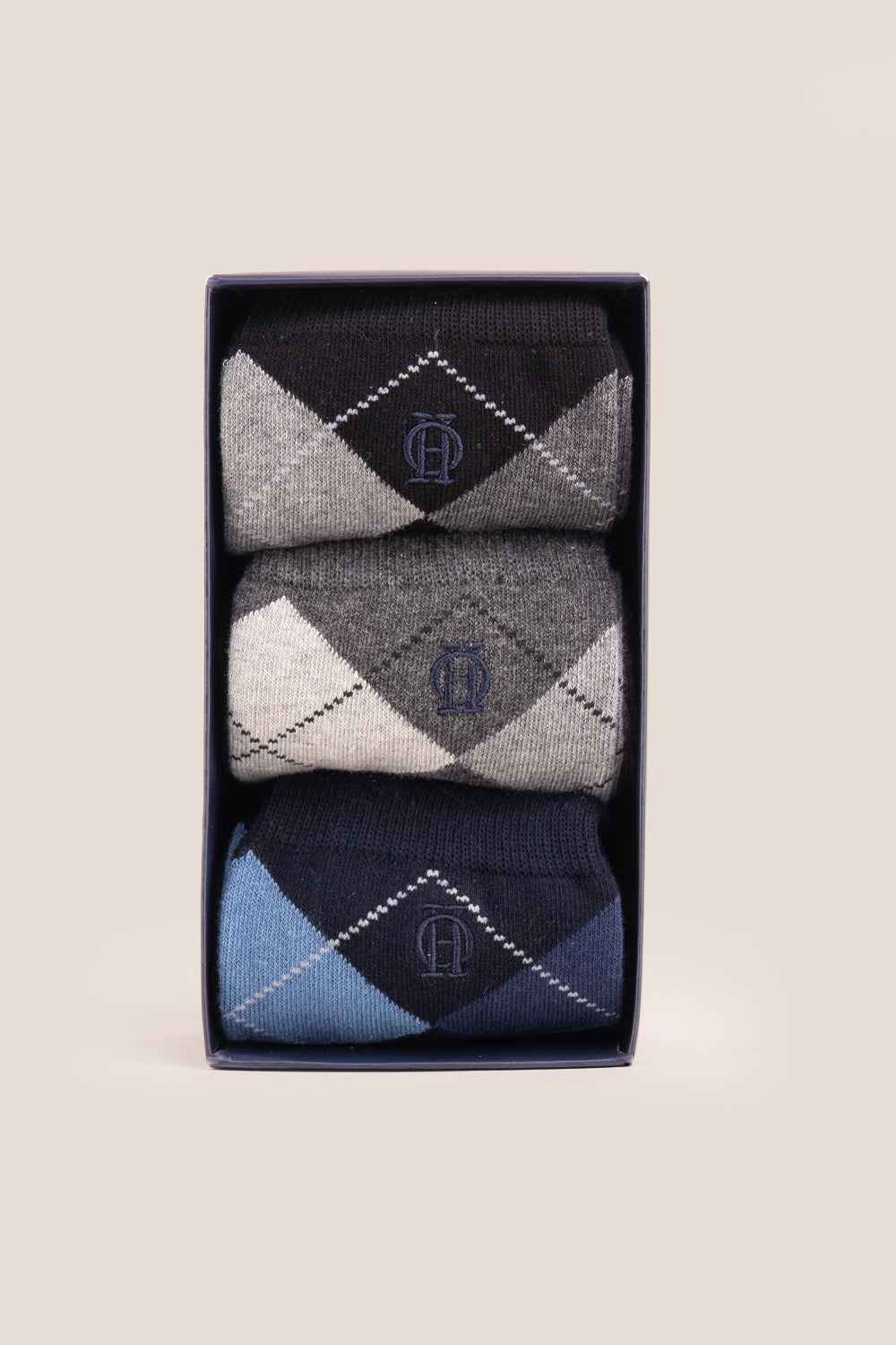 Three pairs of premium cotton socks designed by Oswin Hyde for the discerning gentleman.