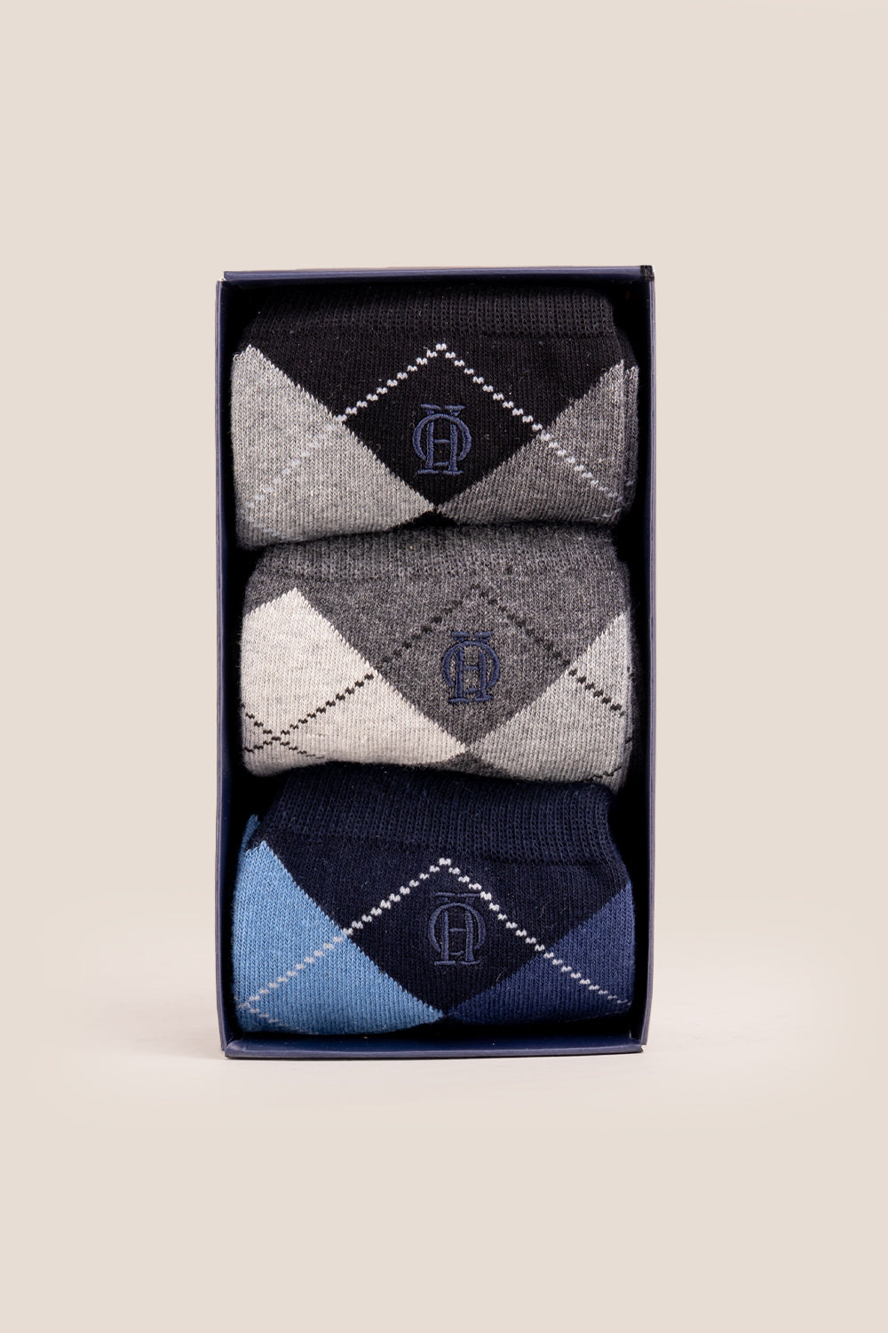 Three pairs of premium Scotch Argyle cotton socks designed by Oswin Hyde for the discerning gentleman.