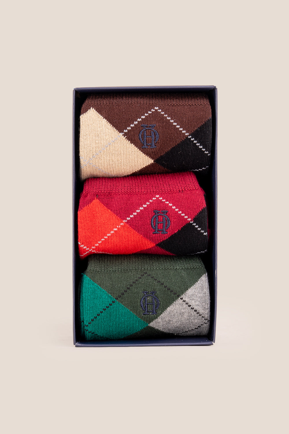 Three pairs of premium cotton bold argyle socks designed by Oswin Hyde for the discerning gentleman.
