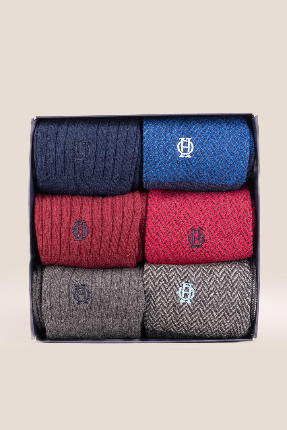 Six pairs of premium herringbone socks designed by Oswin Hyde for the discerning gentleman.