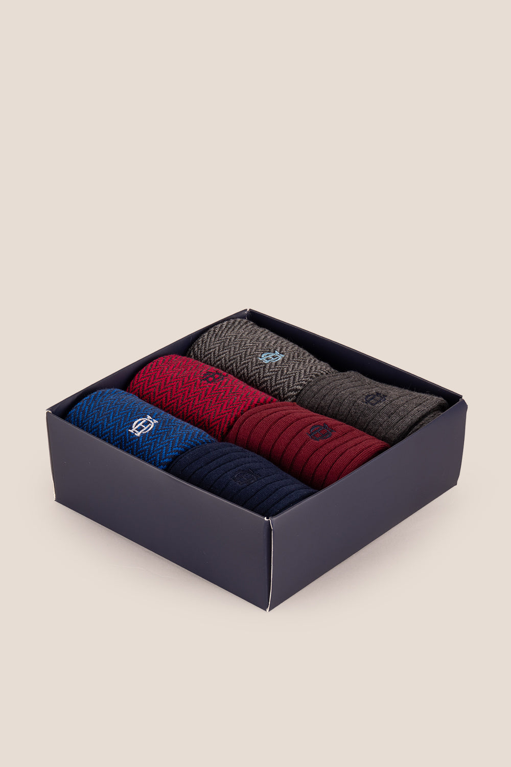Six pairs of premium herringbone socks designed by Oswin Hyde for the discerning gentleman.