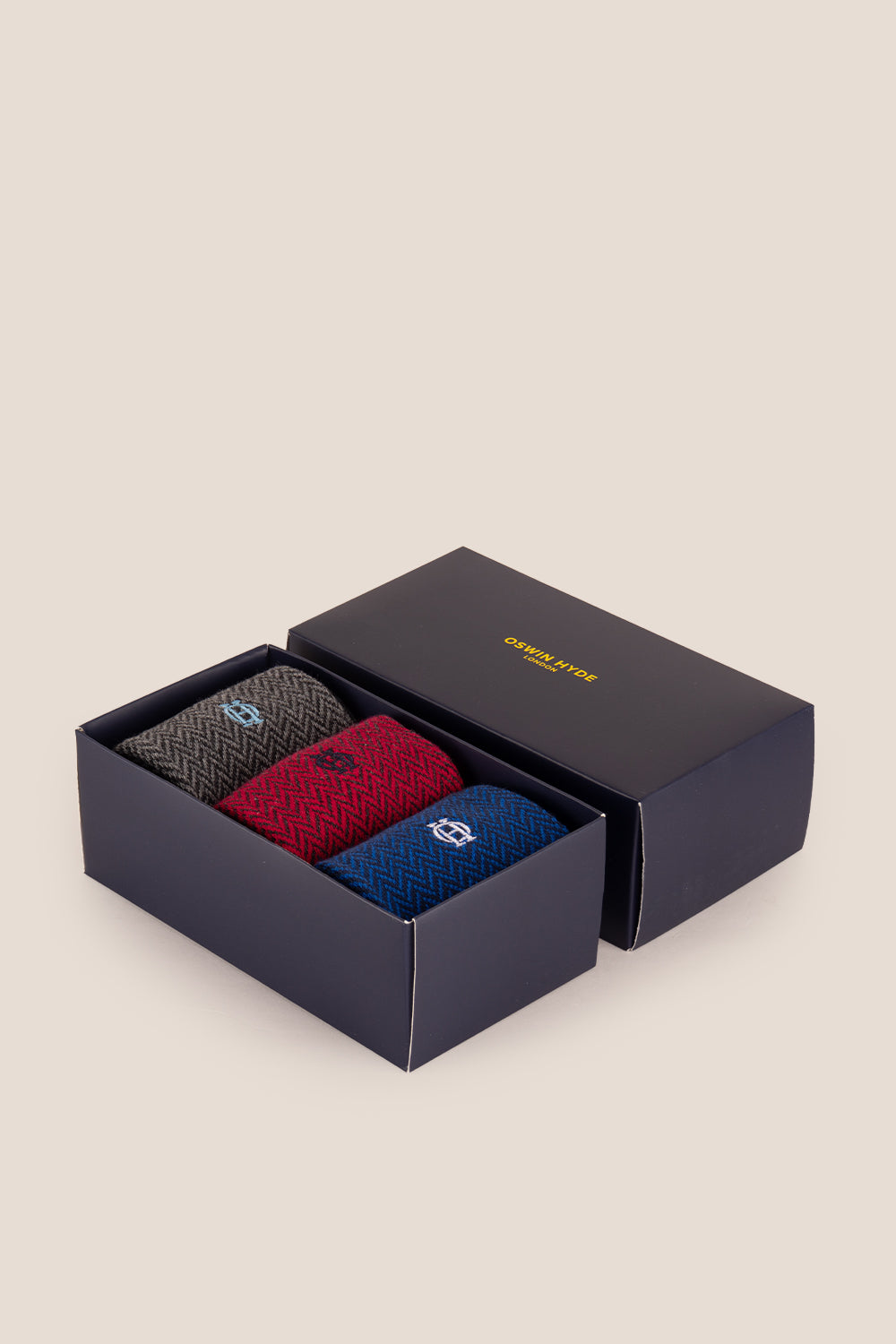 Three pairs of premium herringbone socks designed by Oswin Hyde for the discerning gentleman.