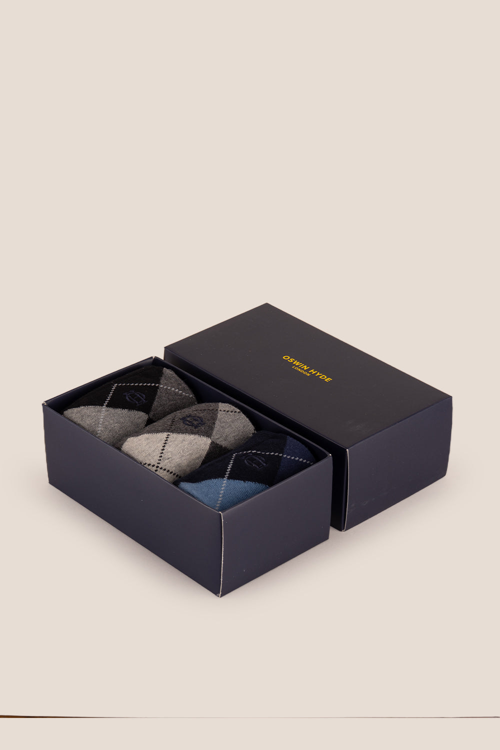 Three pairs of premium cotton socks designed by Oswin Hyde for the discerning gentleman.