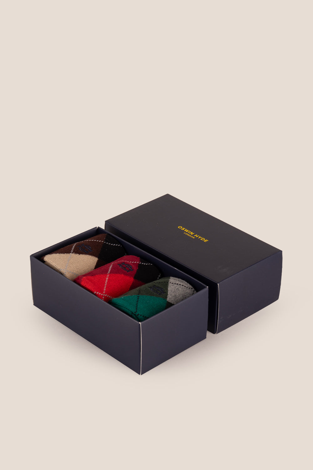 Three pairs of premium cotton socks designed by Oswin Hyde for the discerning gentleman.