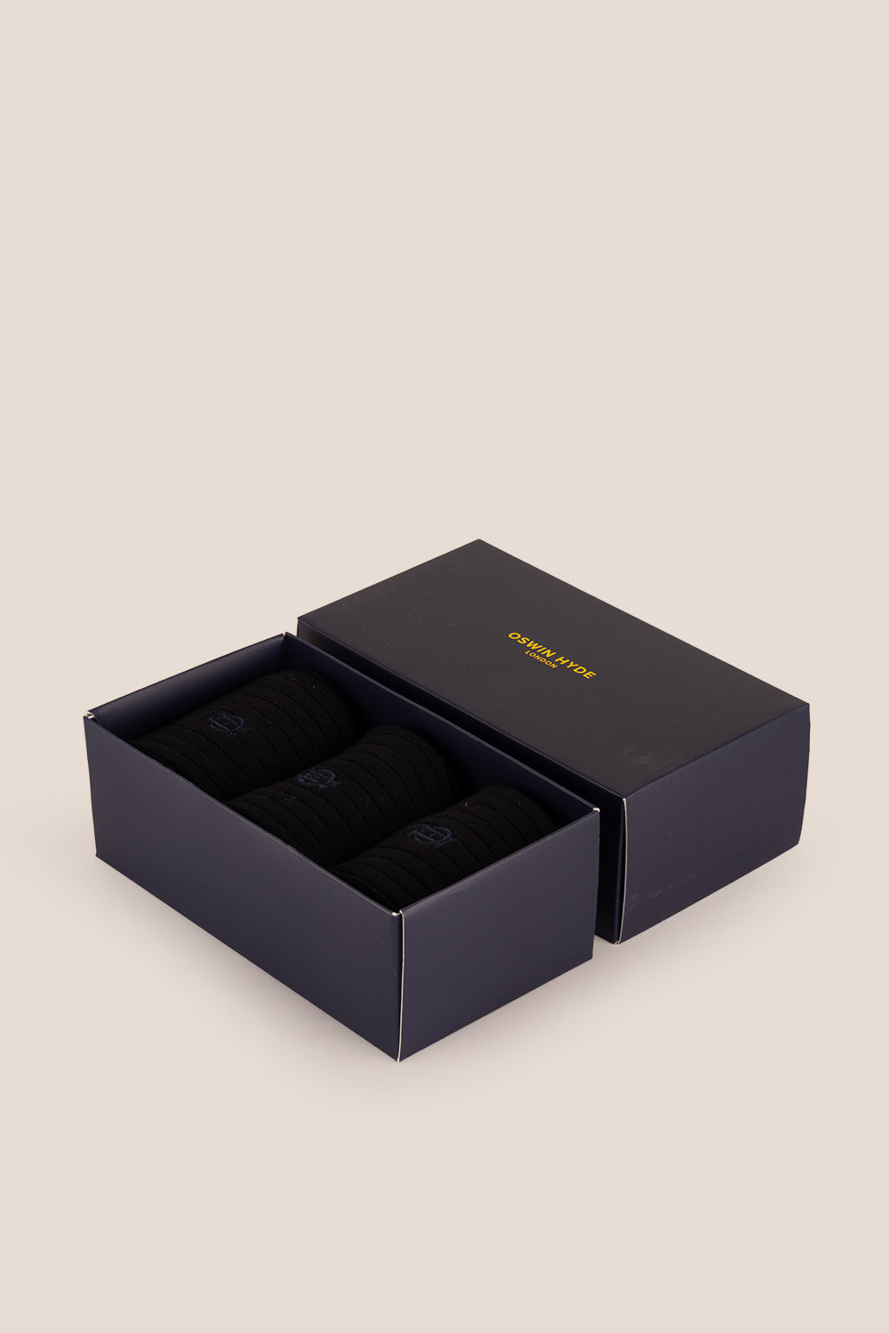 Three pairs of premium Navy cotton socks designed by Oswin Hyde for the discerning gentleman.