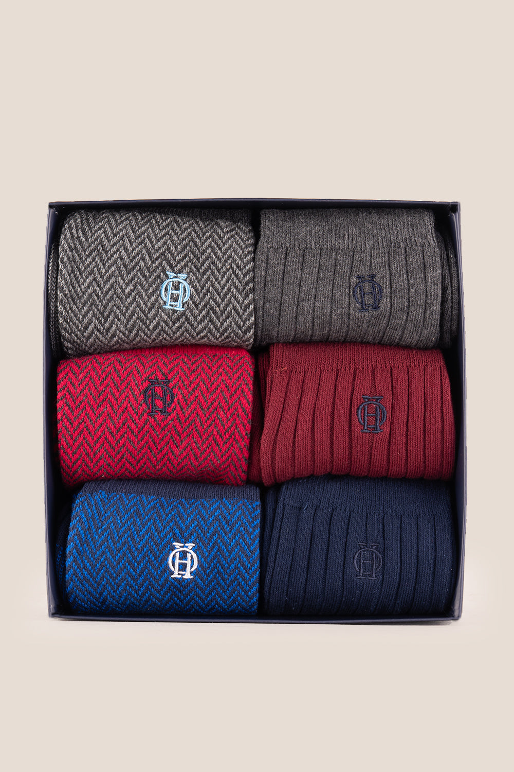 Six pairs of premium herringbone socks designed by Oswin Hyde for the discerning gentleman.