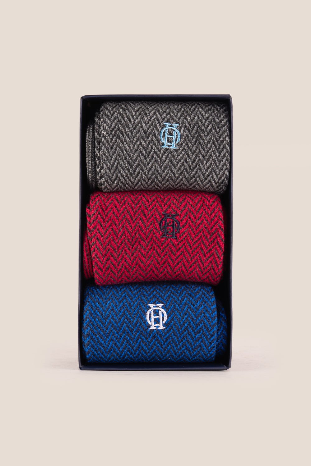 Three pairs of premium herringbone socks designed by Oswin Hyde for the discerning gentleman.