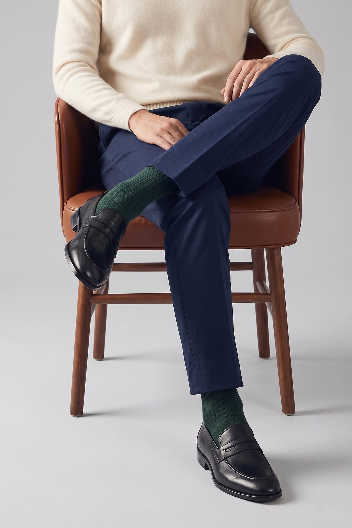 Model wearing Wyatt Black men’s leather loafer made from high-quality crust leather with classic design, ideal for smart casual and formal wear.