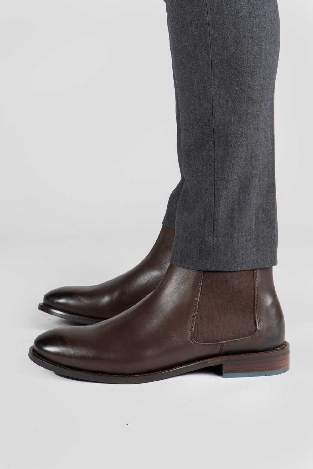 model wearing Men's brown leather Chelsea boot