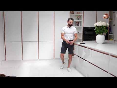 video showing model Men's white leather trainers with white sole