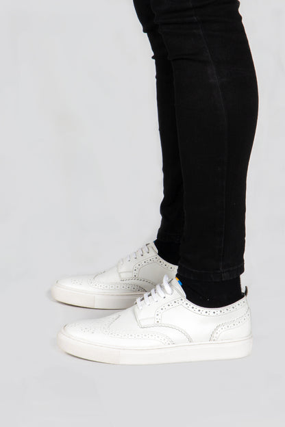 model wearing Men's white leather sneakers with white sole