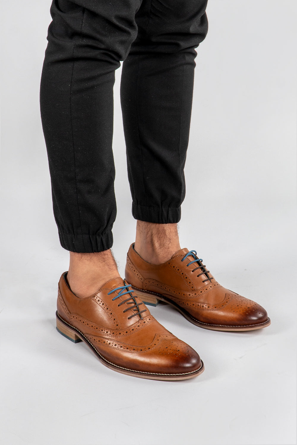 Man wearing tan brogue shoes