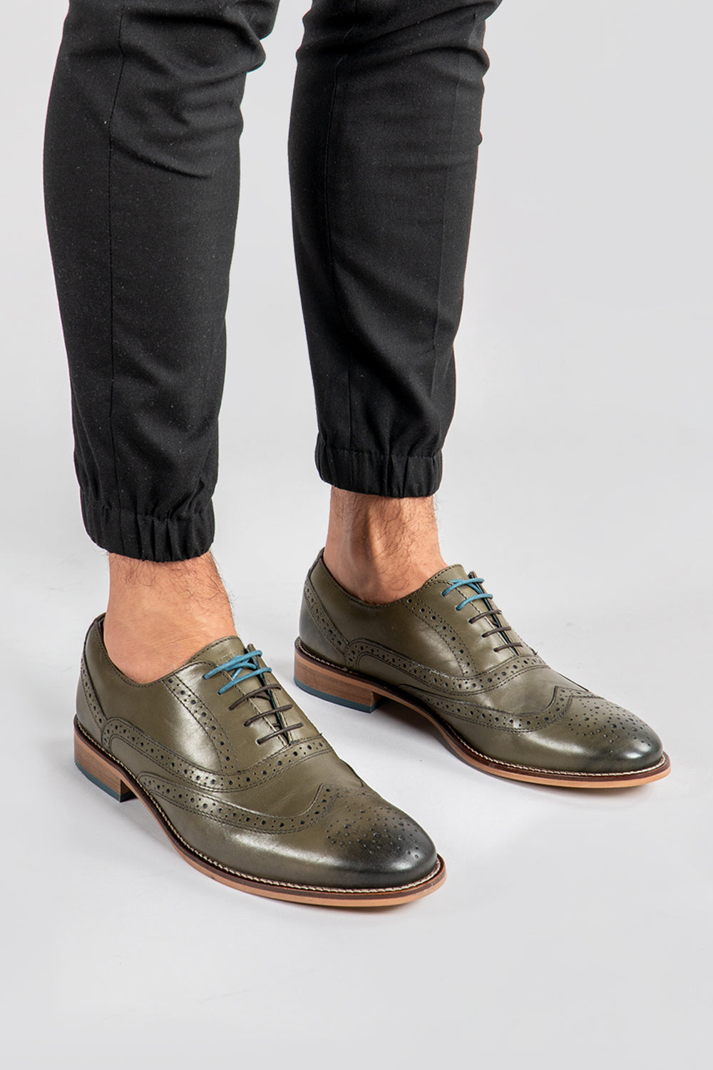 Pair of green leather brogue shoe 